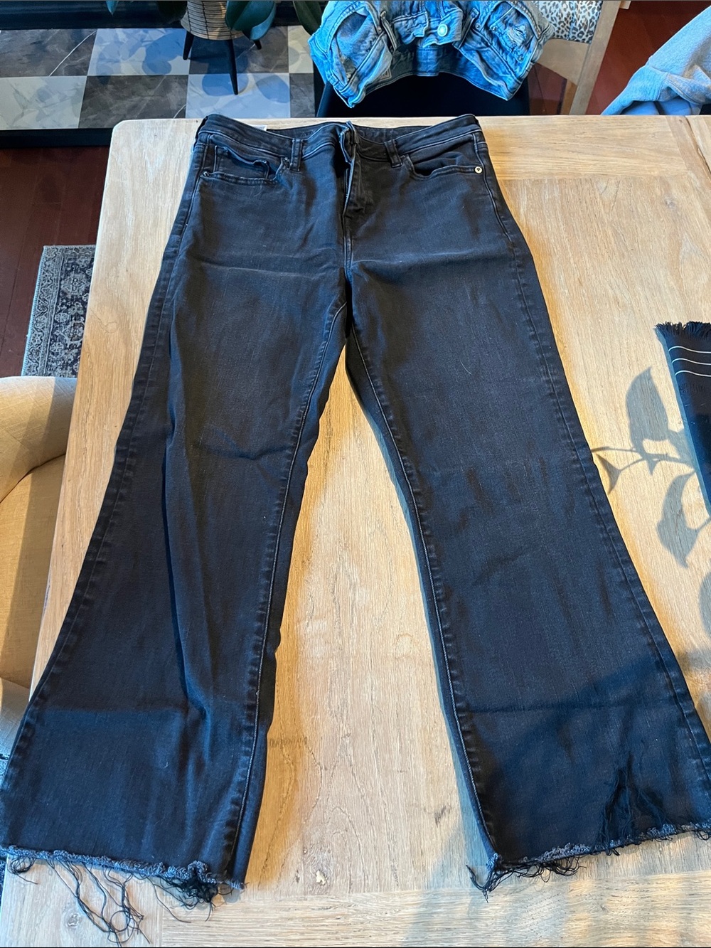 American Eagle next level stretch Women’s Black Flared Jeans with Raw Hem
